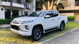Pearl White Mitsubishi Strada 2019 for sale in Quezon 