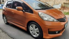 Orange Honda Jazz 2013 for sale in Quezon City