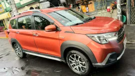 Selling a SUPER GOOD CONDITION 2021 Suzuki XL7 GLX A/T in Orange