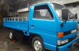 ISUZU NKR 4BE1 4W dropside 10ft Metal Flr 