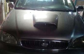 Kia carnival mazda familia rayban