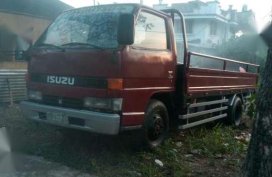 Isuzu Elf Dropside 1999 Red MT For Sale