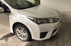 Selling my Pearl White Corolla Altis 1.6