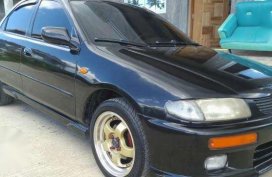 Mazda 323 1997 AT Black Sedan For Sale