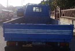 Isuzu ELF 14ft dropside flat bed truck slightly negotiable
