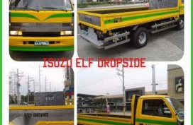 Isuzu elf dropside and isuzu elf close van