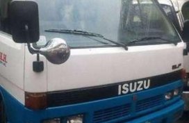 isuzu elf dropside and boomtruck