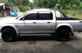 Strada Mitsubishi  truck silver for sale 