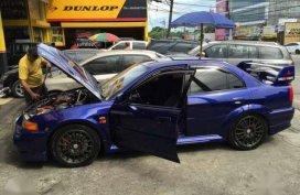 Mitsubishi Evolution sedan blue for sale 