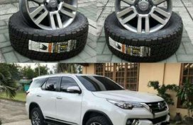 Toyota 4runner oem wheels 20x8. Nitto terra 265 50 20 tires.