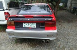 toyota super custom van and mitsubishi lancer