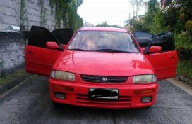 Mazda 323 Familia 1996 red for sale