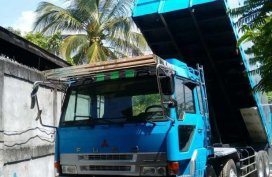 Blue Fuso Cargo dump truck