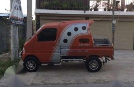 Vehicle Suzuki Multi-cab orange for sale