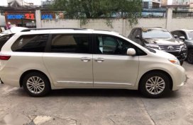 2015 Toyota Sienna XLE White on beige leather. 