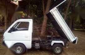 Multicab Suzuki 4x4 gas mini dump.