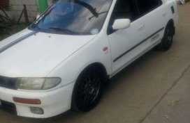 Mazda 323 Familia AT White Sedan For Sale 