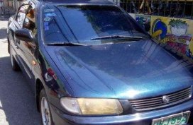 Mazda Familia car 4 door 1997