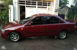 Selling lady driveN Mazda Familia 323 1996 