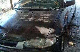 Like new Mazda 323 sedan for sale