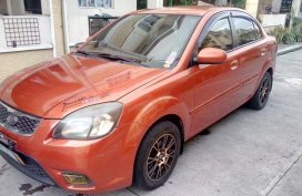 Selling Orange Kia Rio 2011 Automatic Gasoline in Quezon City