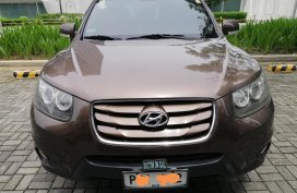 Brown Hyundai Santa Fe 2010 for sale in Quezon City 