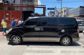 Black Hyundai Grand Starex 2011 at 85000 km for sale 