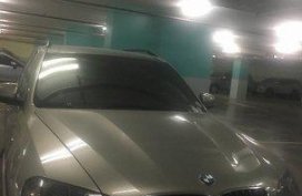 Selling Silver Bmw X5 2010 at 57000 km 