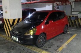 Red Honda Fit 2008 at 95000 km for sale
