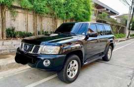 Selling Black Nissan Patrol 2009 at 58000 km 