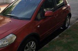 Orange Suzuki Sx4 2014 at 65000 km for sale in Manila