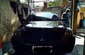 Selling Black Mitsubishi Lancer 2010 Manual Gasoline at 115000 km 