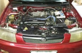 Selling Red Mazda 323 1999 Manual Gasoline in General Salipada K. Pendatun