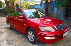 Selling Red Mitsubishi Lancer 2003 at 100000 km 