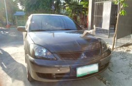 Sell Grey 2009 Mitsubishi Lancer in Quezon City
