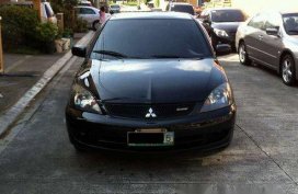 Sell Black 2009 Mitsubishi Lancer in Quezon City