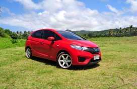 Red Honda Jazz 2015 for sale in Quezon City