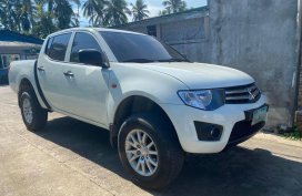 Sell White Mitsubishi Strada in Lipa