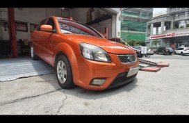 Selling Orange Kia Rio 2010 Sedan in Manila