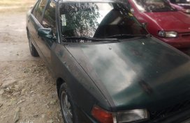 Sell Black Mazda 323 for sale in Valenzuela