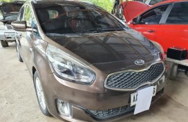 Brown Kia Carens for sale in Butuan