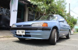 Selling Blue Mazda 323 in Las Piñas
