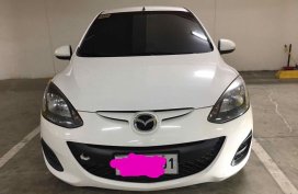 Selling White Mazda 2 in Manila