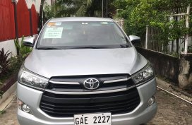 SILVER METALLIC TOYOTA INNOVA 2.8 E M/T 2018 with Franchise and Airport Sticker 