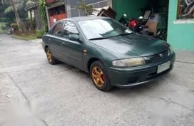 Green Mazda 323 for sale in Bulacan