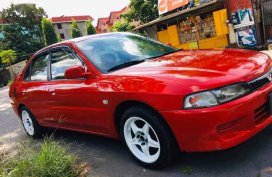 Red Mitsubishi Lancer for sale in Quezon City