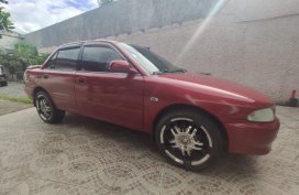 Red Mitsubishi Lancer 2004 for sale in Taytay