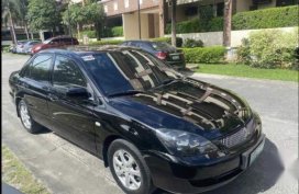 Black Mitsubishi Lancer 2011 for sale in Quezon