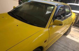Yellow Mitsubishi Lancer 1994 for sale in Pateros