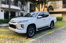 Pearl White Mitsubishi Strada 2019 for sale in Quezon 